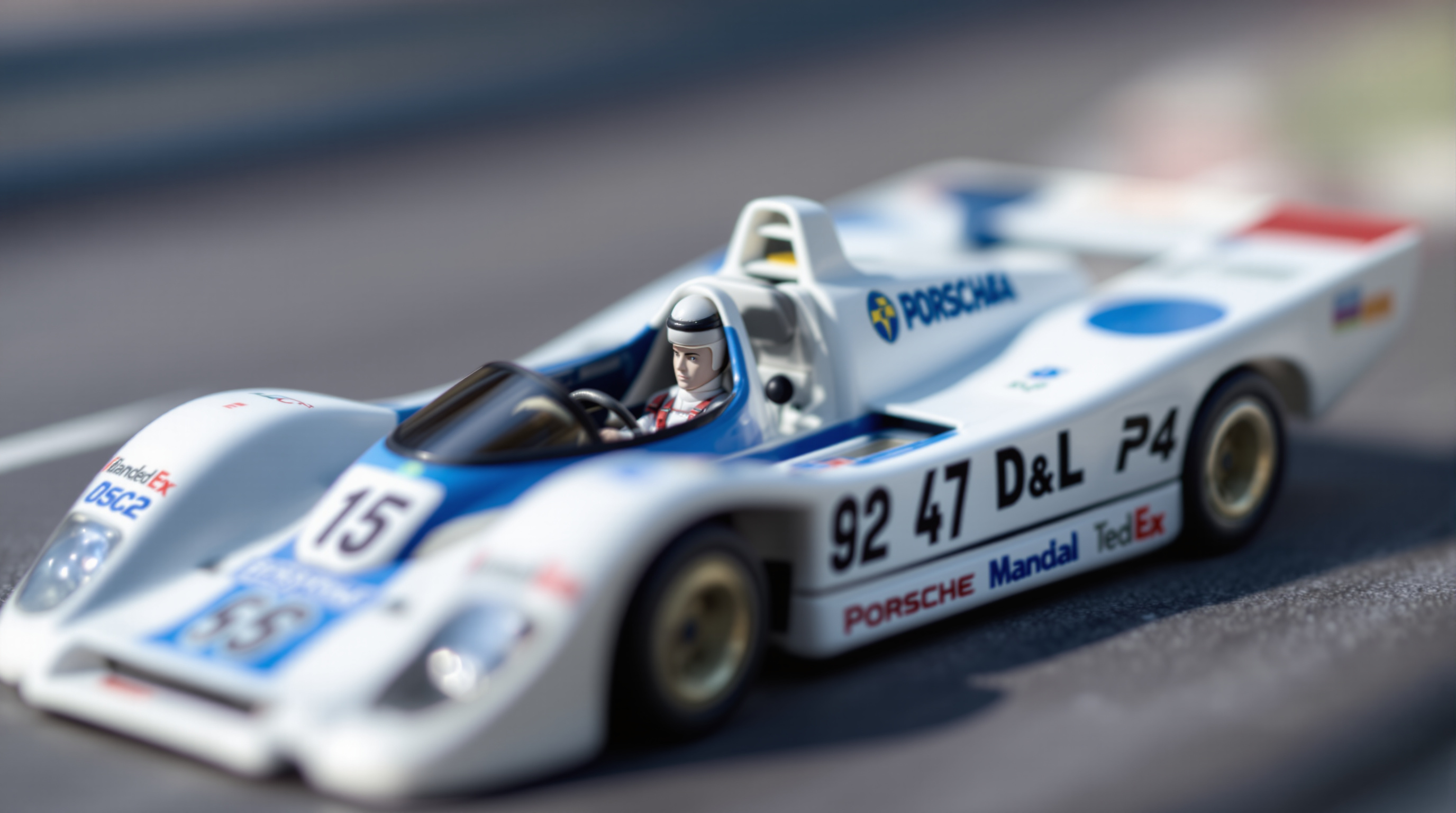 Slot car racer preparing ES32 scale car in pit area, tools and spare parts arranged on workbench